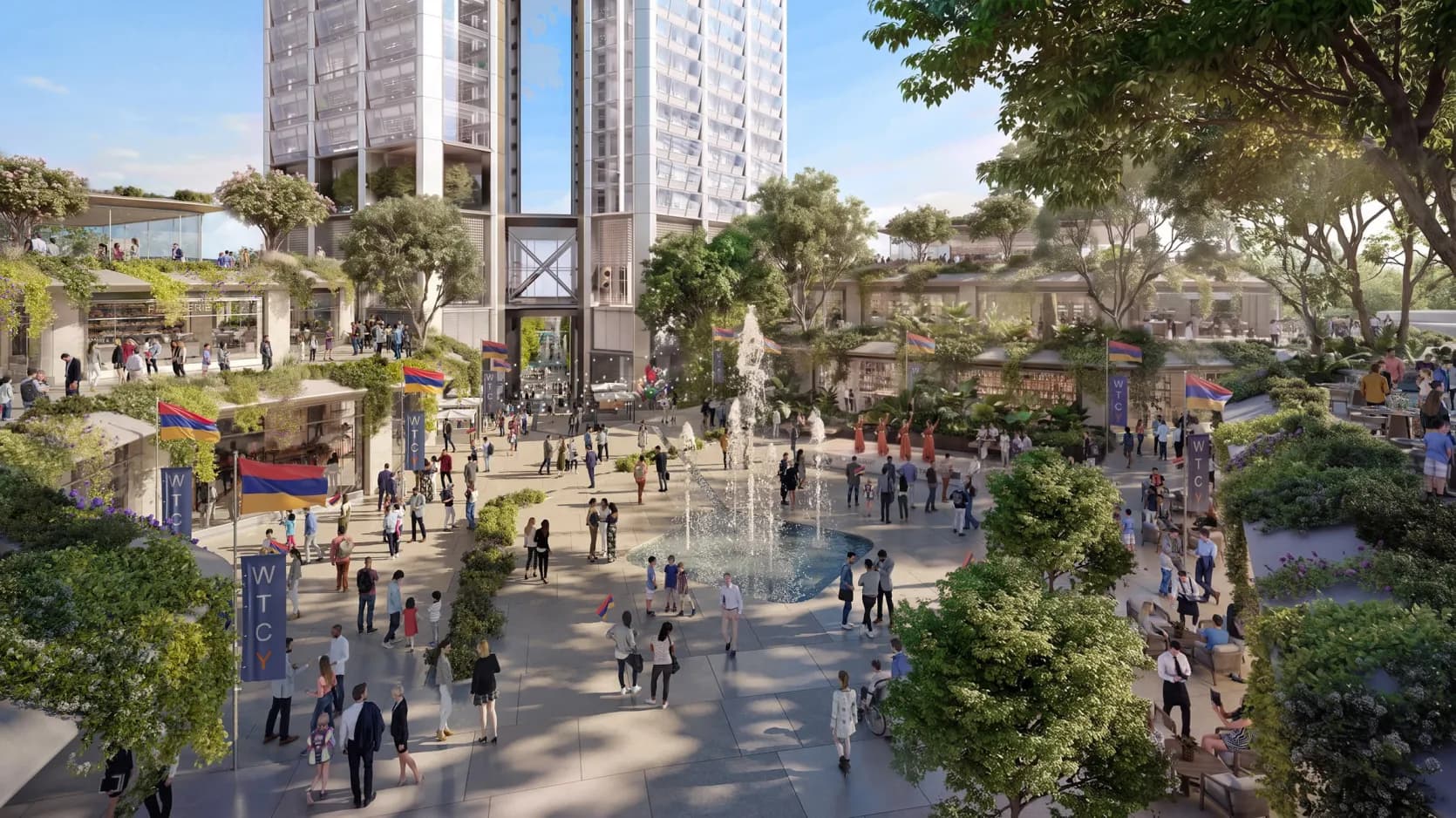 Visualisation d’une place publique animée avec une fontaine, des arbres et des drapeaux arméniens entre des bâtiments bas en terrasses aux toits plantés, avec à l’arrière la base des deux tours et la passerelle vitrée qui les relie